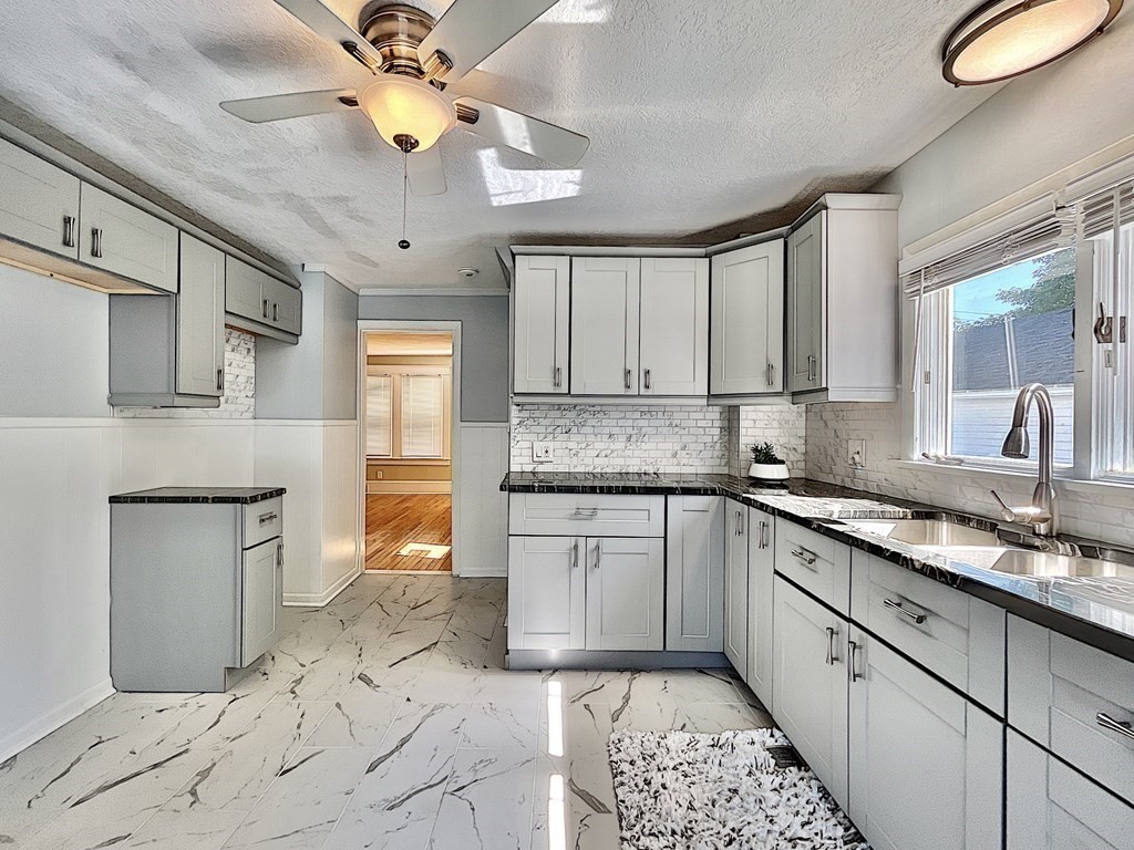 3155 Boston Road Wilbraham, MA 01095 - Photo 9 of 24 a kitchen with a sink cabinets and window