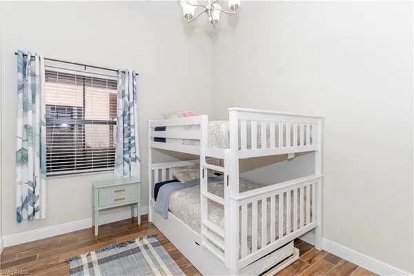 a view of a bedroom with furniture