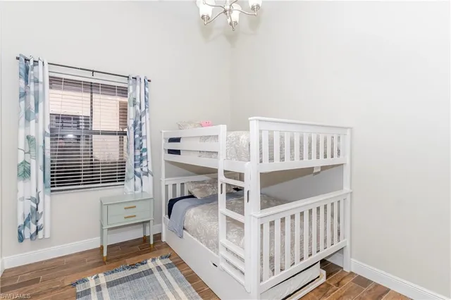 a view of a bedroom with furniture