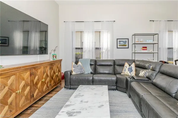 a living room with furniture with wooden floor