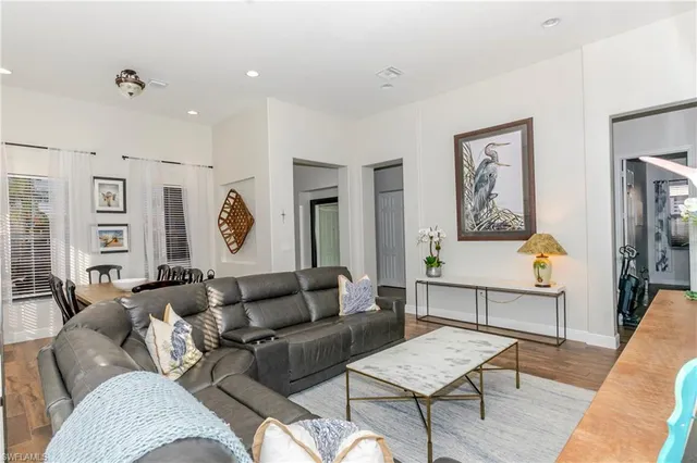 a view of a park with swings and palm trees