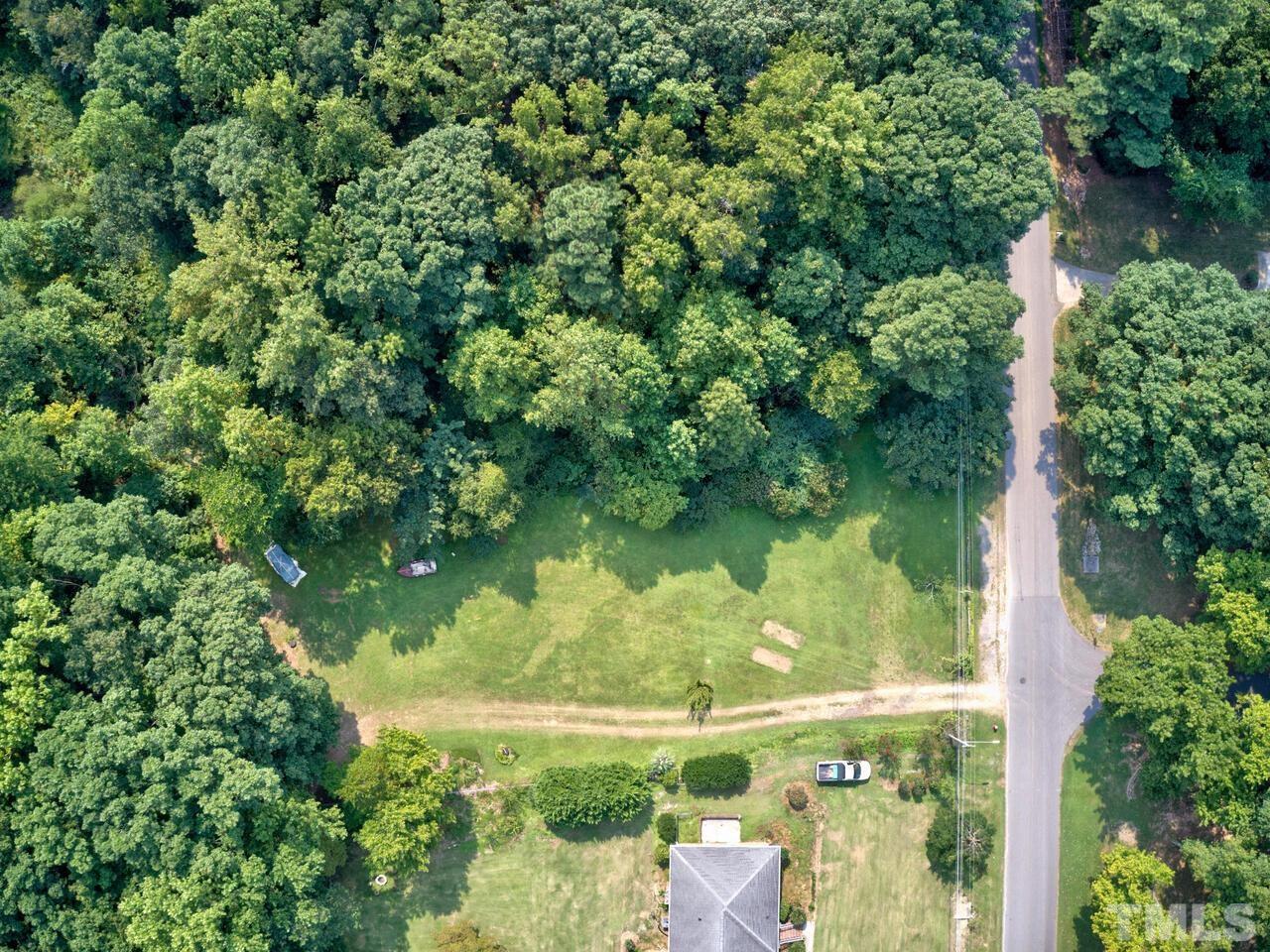 1241 Kingston Ridge Road Cary, NC 27511 - Photo 1 of 3 an aerial view of ocean with green space