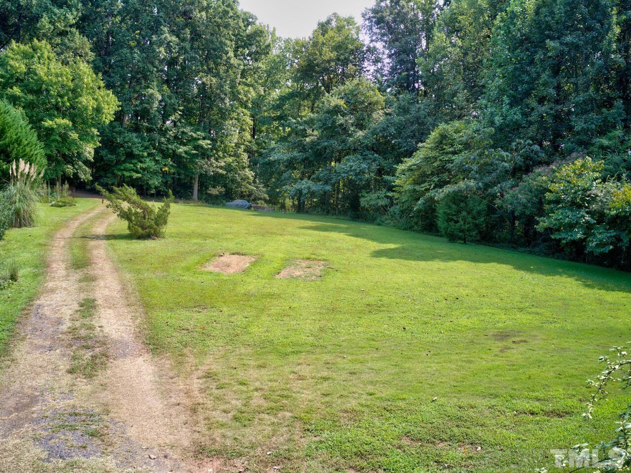 1241 Kingston Ridge Road Cary, NC 27511 - Photo 2 of 3 a view of a yard with a small trees