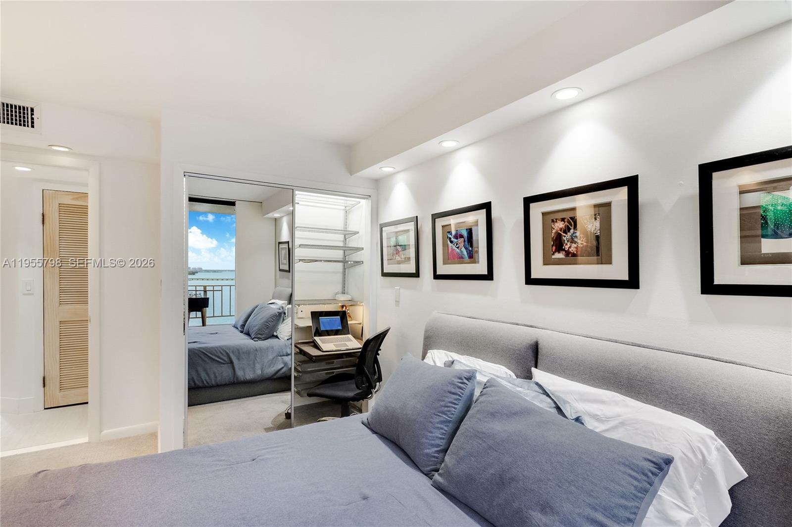 200 Southeast 15th Road, Unit 15C Miami, FL 33129 - Photo 11 of 31 a living room with furniture and a large window