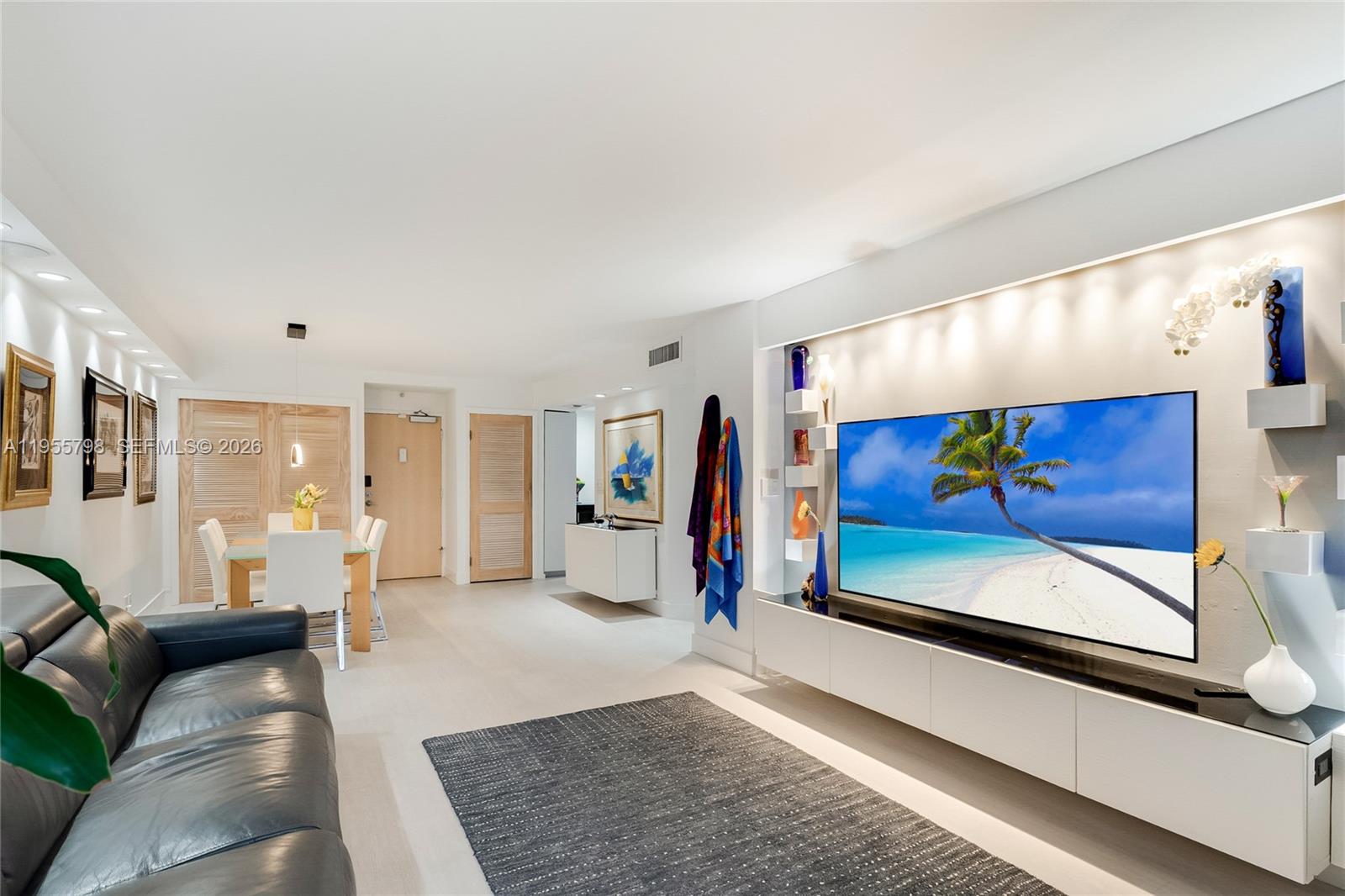 200 Southeast 15th Road, Unit 15C Miami, FL 33129 - Photo 14 of 31 a living room with furniture and a flat screen tv