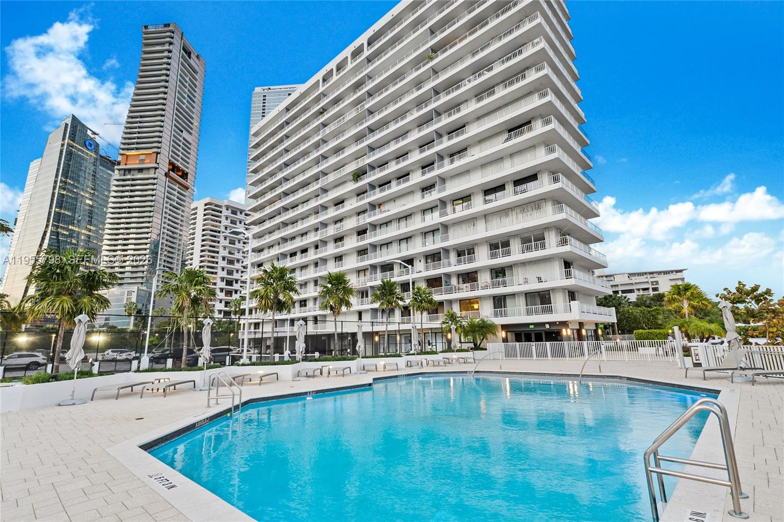 200 Southeast 15th Road, Unit 15C Miami, FL 33129 - Photo 20 of 31 a view of a swimming pool with a balcony