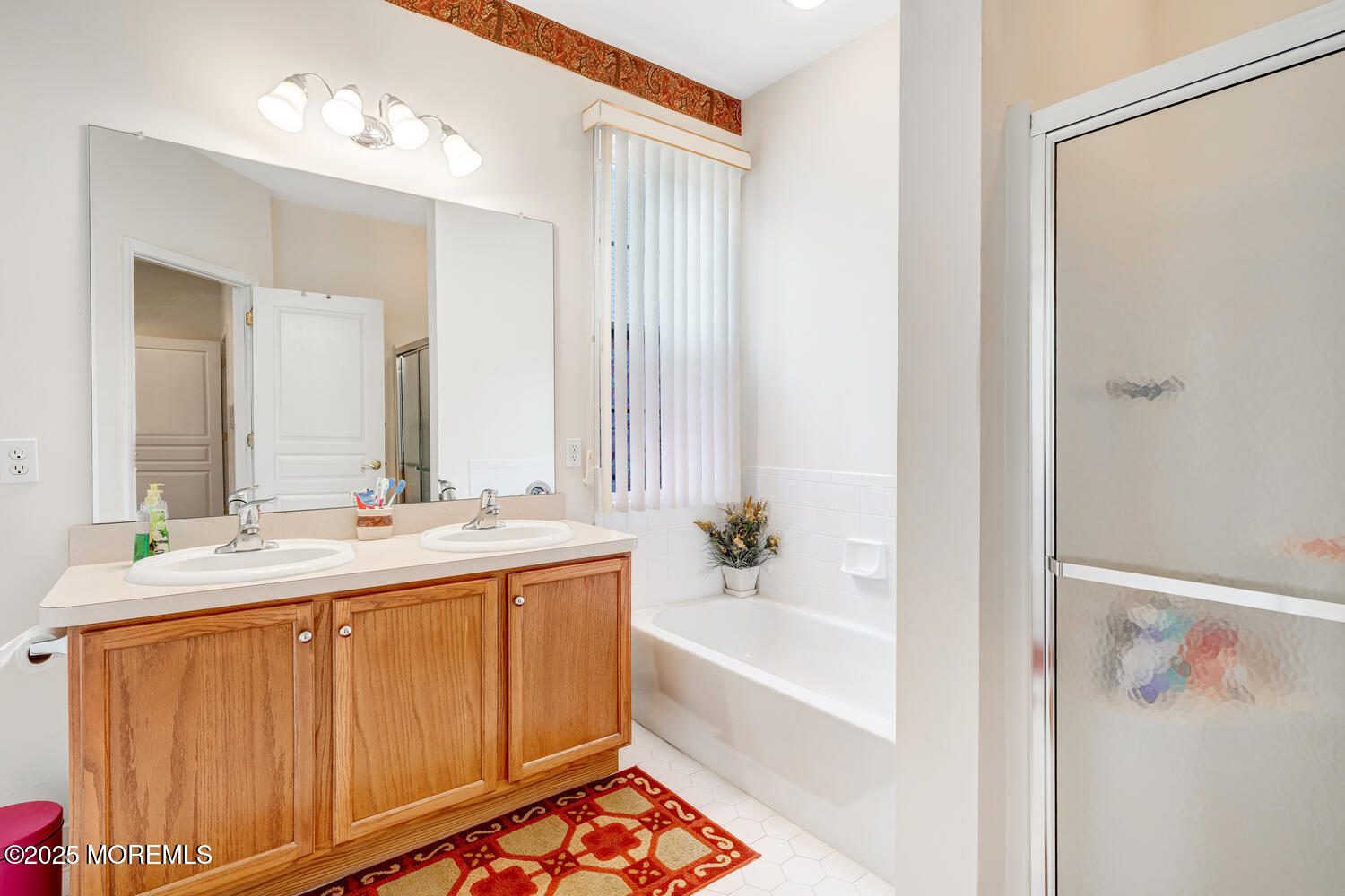 16 Seagull Drive Little Egg Harbor, NJ 08087 - Photo 14 of 27 a bathroom with a tub sink and mirror