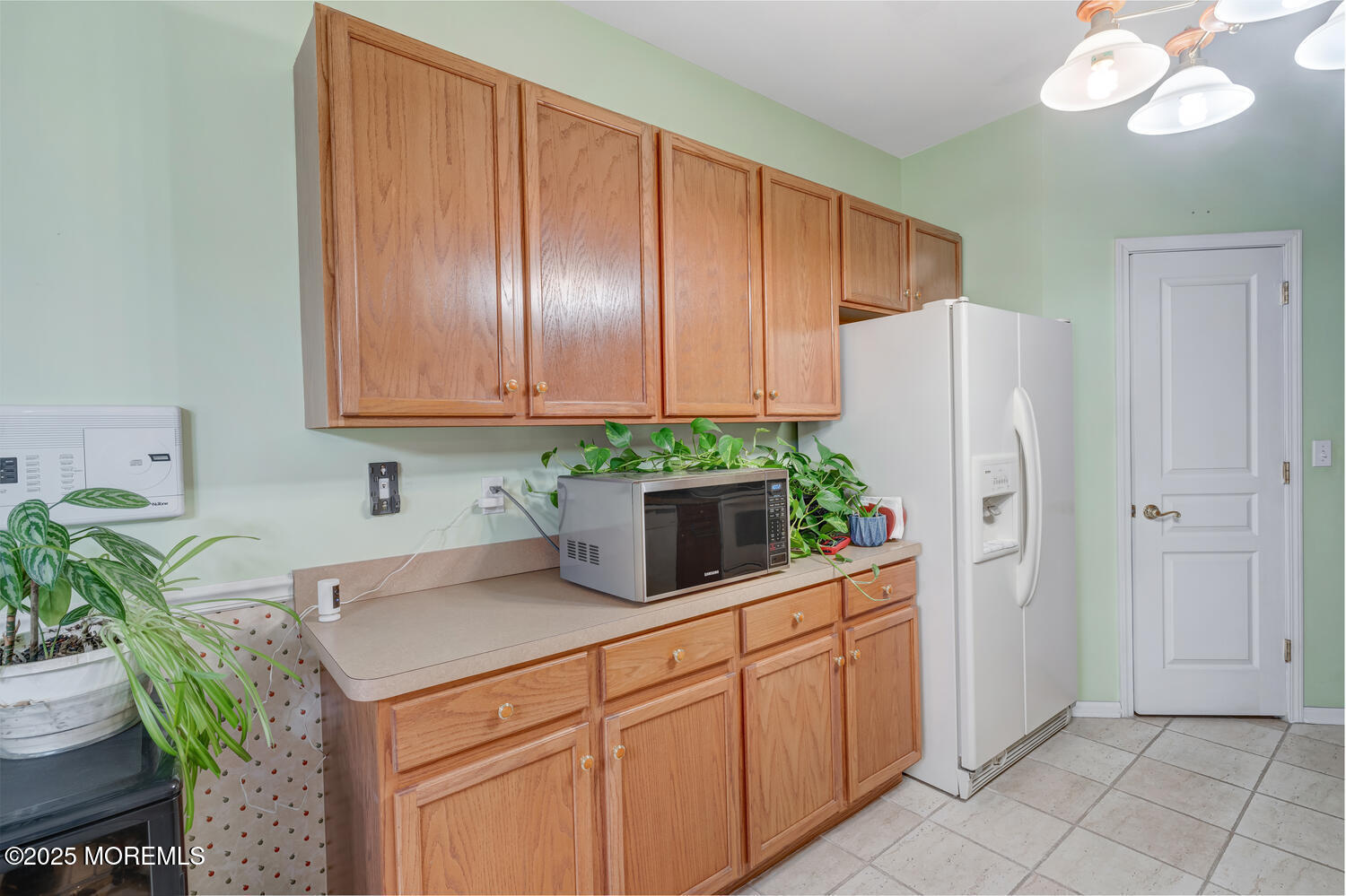 16 Seagull Drive Little Egg Harbor, NJ 08087 - Photo 18 of 27 a kitchen with stainless steel appliances granite countertop a refrigerator a stove a sink a counter space and cabinets