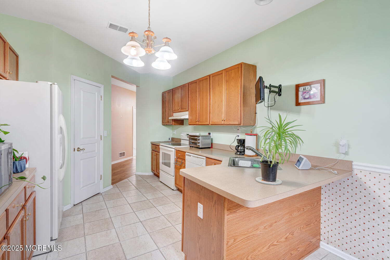 16 Seagull Drive Little Egg Harbor, NJ 08087 - Photo 19 of 27 a kitchen with a sink a counter top space and cabinets