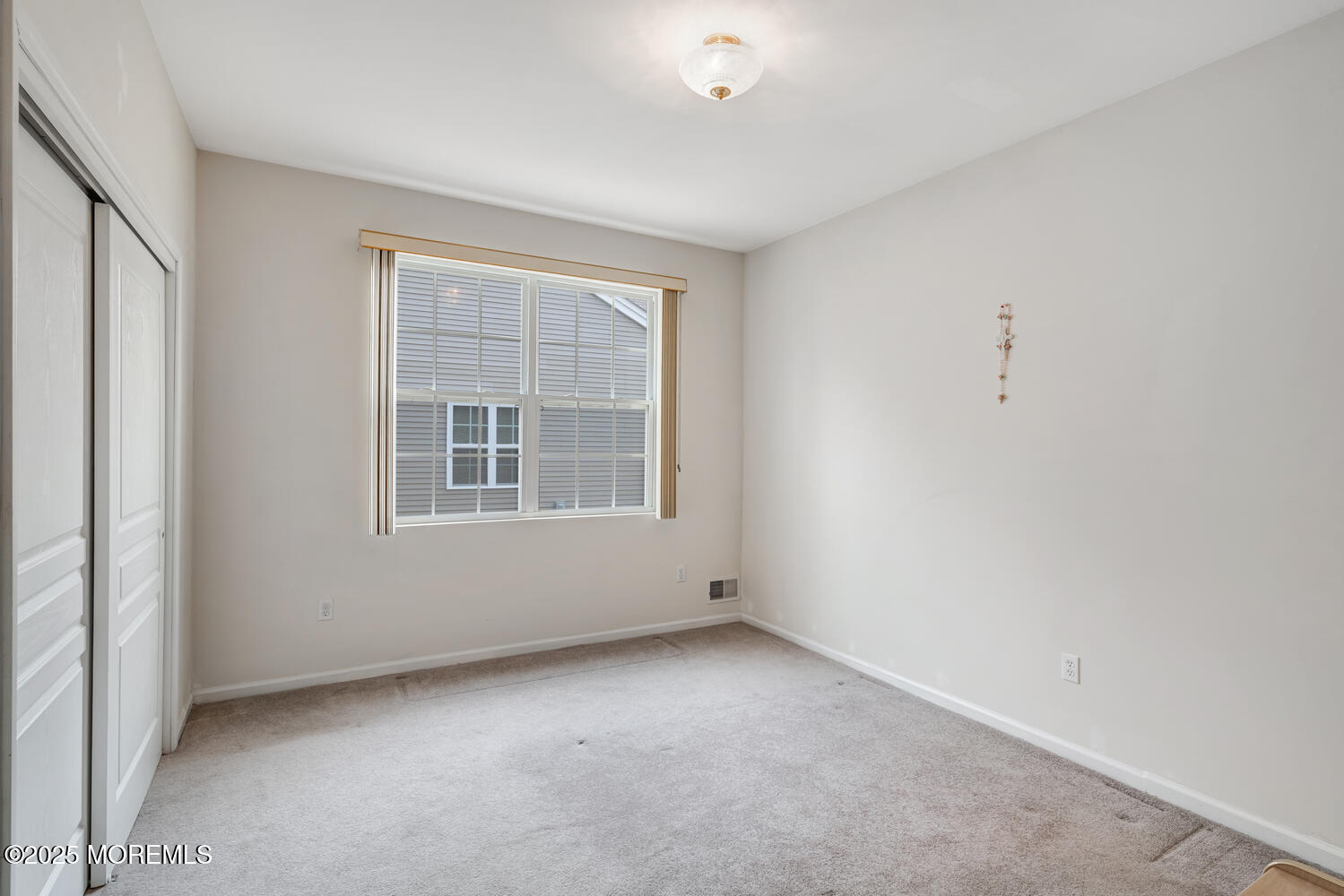 16 Seagull Drive Little Egg Harbor, NJ 08087 - Photo 7 of 27 an empty room with a window