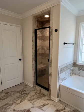 a bathroom with a shower and bathtub