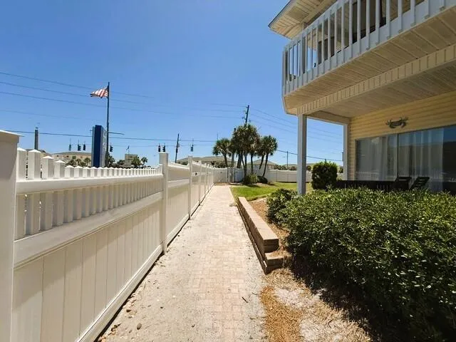 an aerial view of a house with a swimming pool