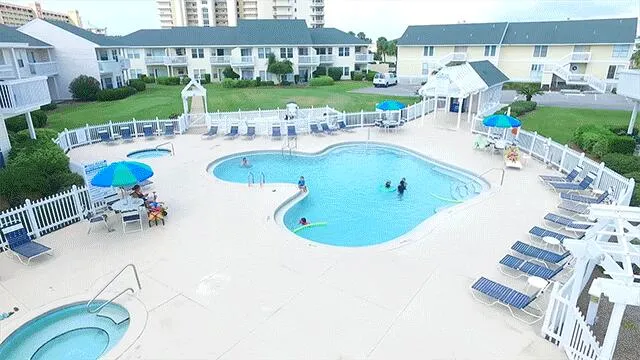 a view of swimming pool from a balcony