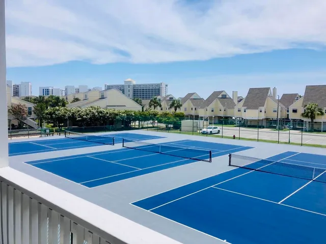 a view of a chairs and table in patio