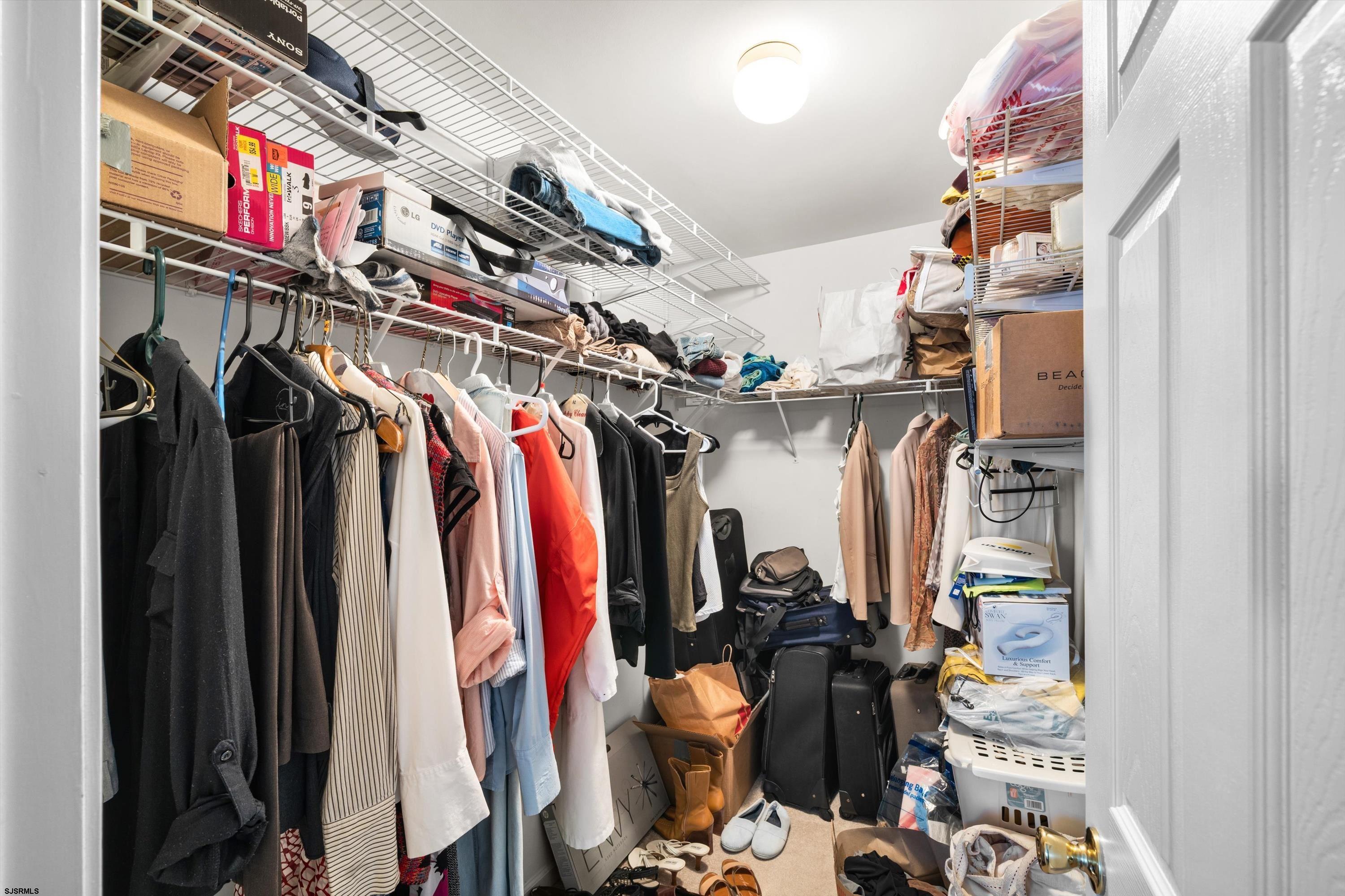 83 Windjammer Drive, Unit 83 Somers Point, NJ 08244 - Photo 26 of 33 a view of walk in closet with clothes