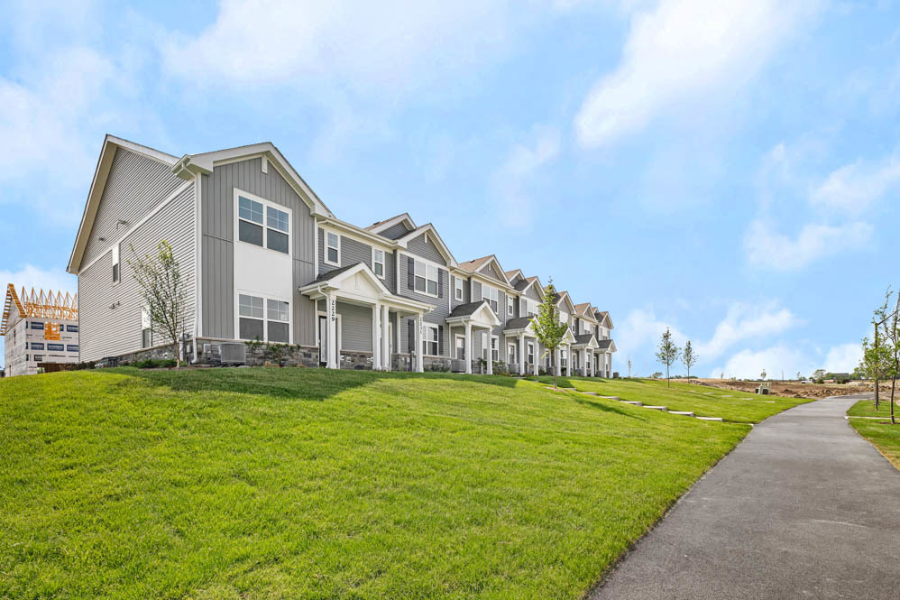 2255 Riesling Road Oswego, IL 60543 - Photo 3 of 27 a front view of a house with a yard