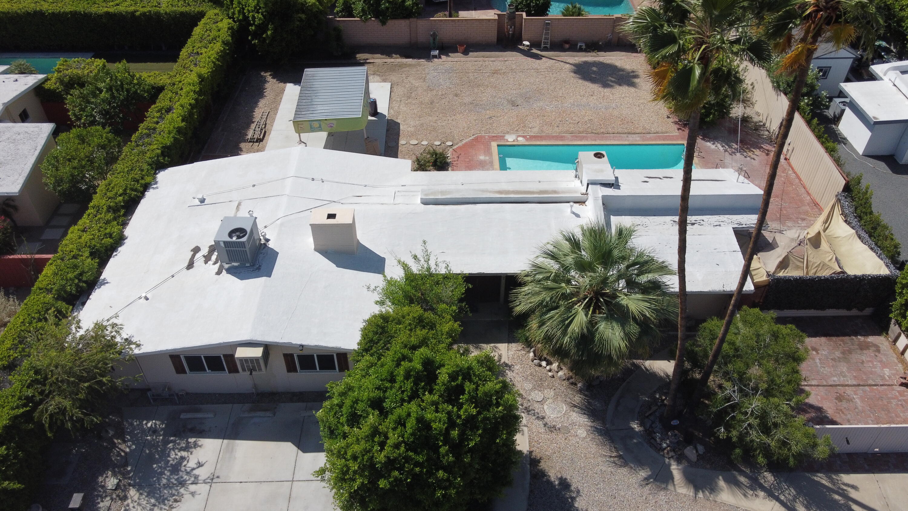 1077 South Riverside Drive Palm Springs, CA 92264 - Photo 5 of 35 an aerial view of a house with a yard and garden