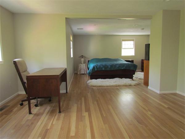 46 Hillcrest Road Weston, MA 02493 - Photo 15 of 21 a bedroom with a bed and a chair