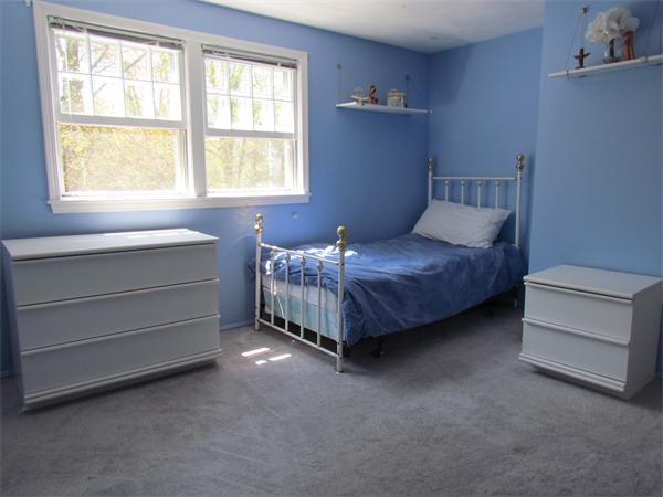 46 Hillcrest Road Weston, MA 02493 - Photo 16 of 21 a room with a bed and a window