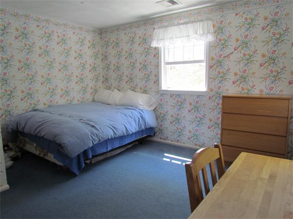 46 Hillcrest Road Weston, MA 02493 - Photo 17 of 21 a bedroom with a bed lamp and window