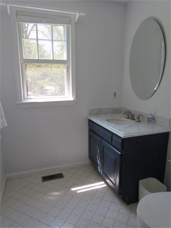 46 Hillcrest Road Weston, MA 02493 - Photo 6 of 21 a bathroom with a sink vanity and a mirror