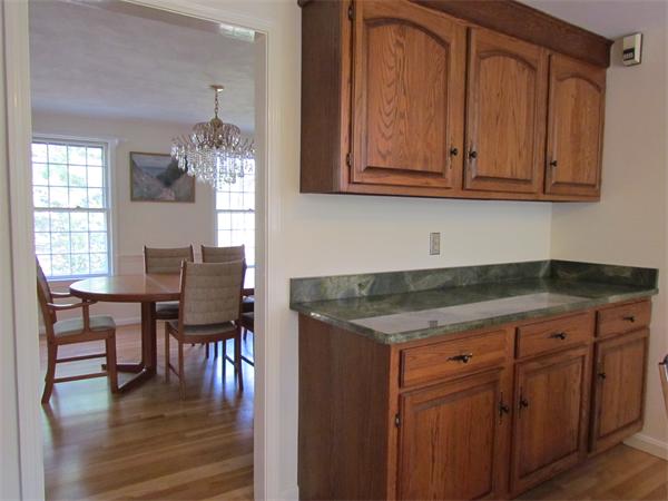 46 Hillcrest Road Weston, MA 02493 - Photo 9 of 21 a kitchen with cabinets and wooden floor