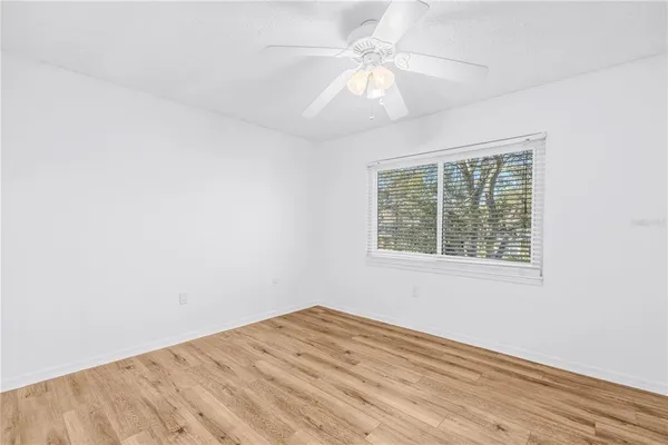 a view of balcony with wooden floor
