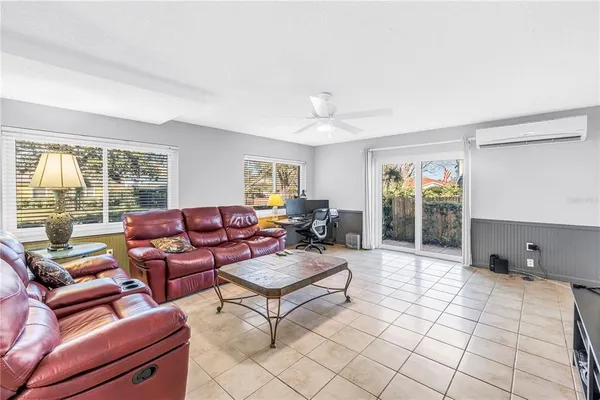 a living room with furniture and a window