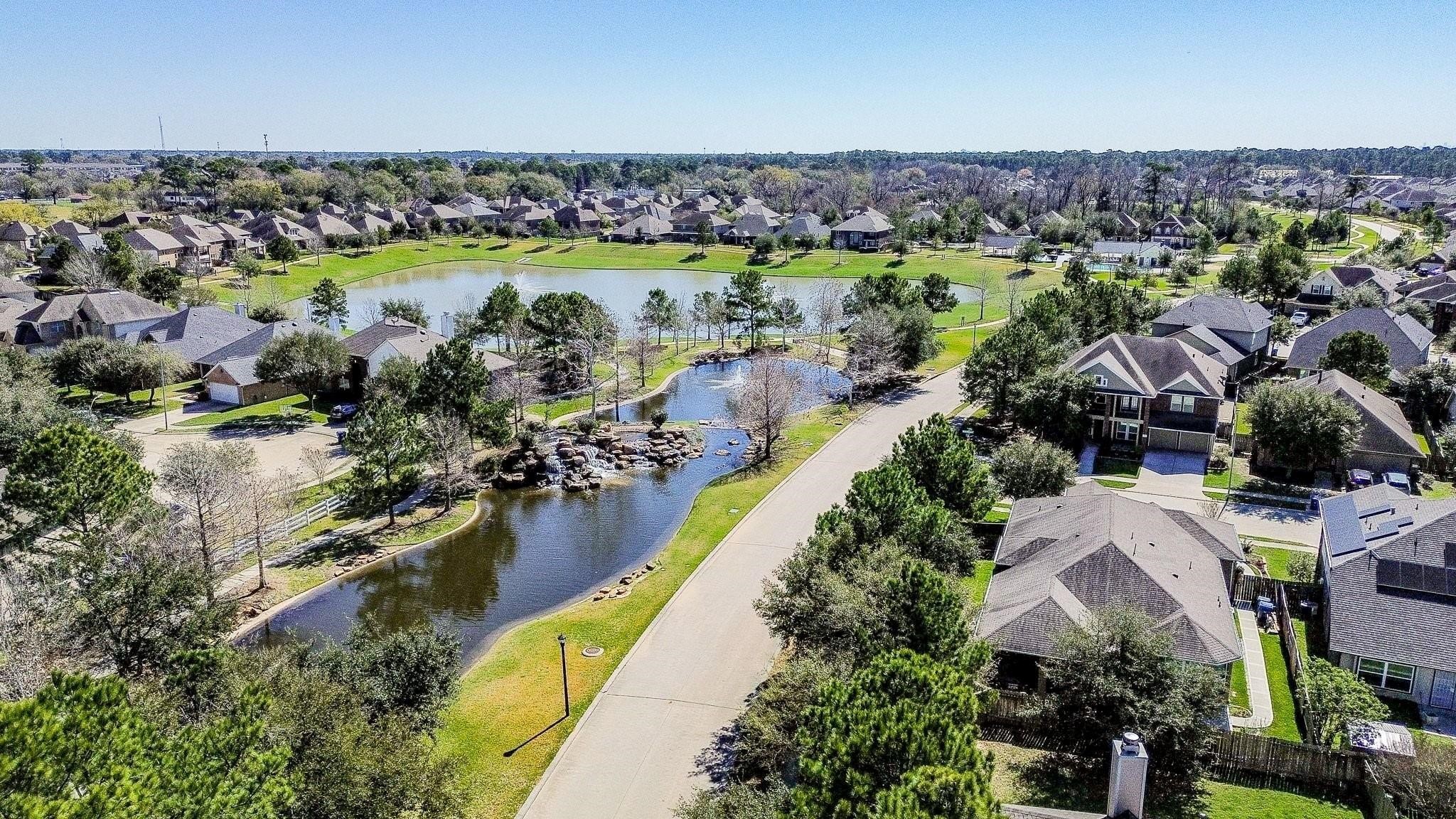7042 Sliding Rock Circle Spring, TX 77379 - Photo 32 of 36 Discover the scenic charm of Twin Falls Community, featuring serene lakes and lush greenery.