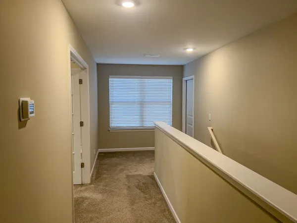 an empty room with closet area