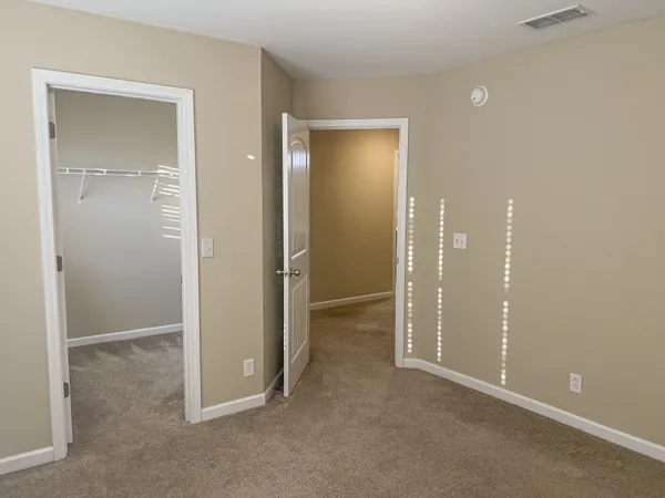 a view of an empty room with windows