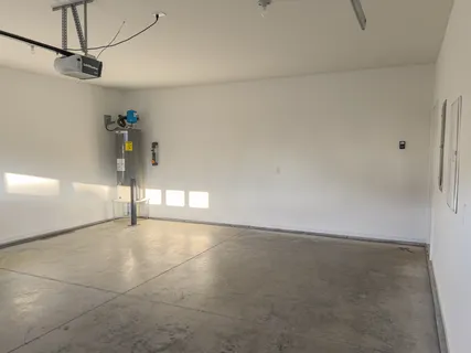 a view of a house with backyard and garden