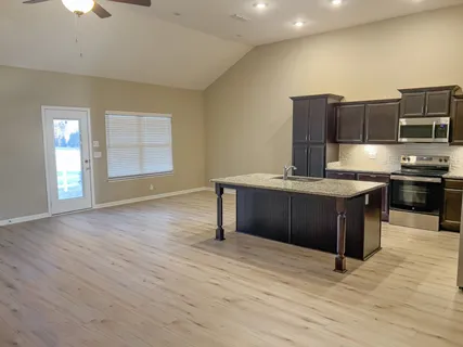 a kitchen with a sink and cabinets