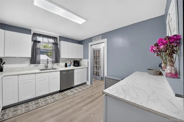 a kitchen with a sink and cabinets