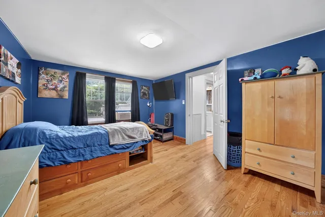 a living room with a bed and furniture
