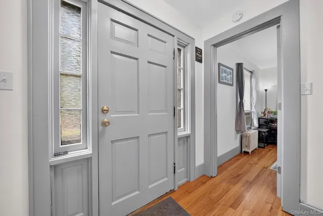 a view of a hallway with bathroom and shower