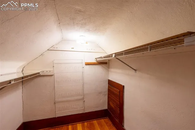 a view of a house with backyard and chairs