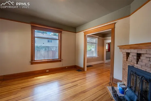 a view of livingroom with hardwood floor and a ceiling fan