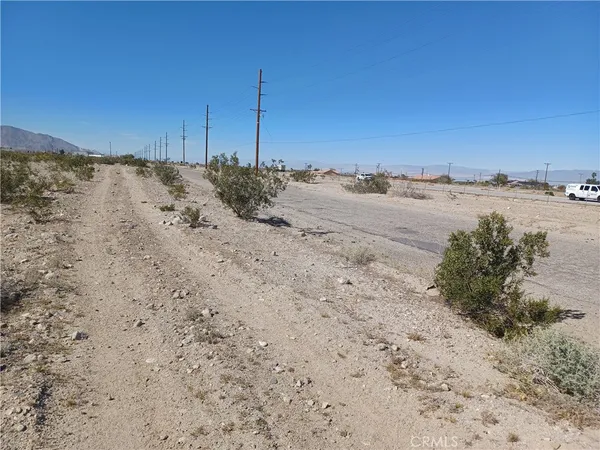 a view of a dry yard with mountain