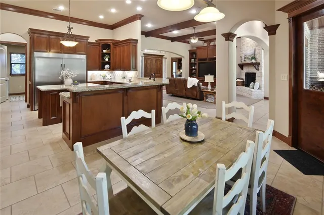 a dining room with furniture and window