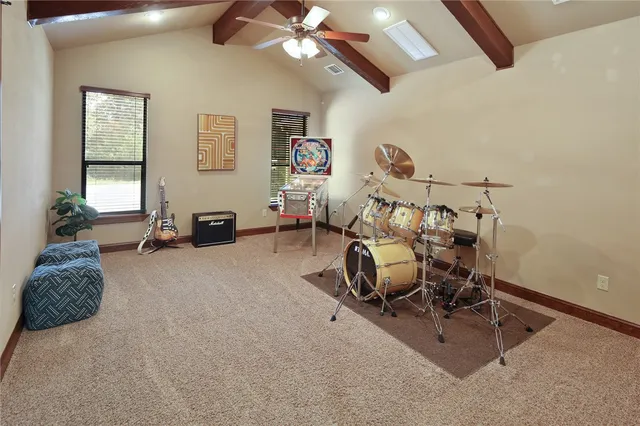 a bedroom with furniture and a ceiling fan