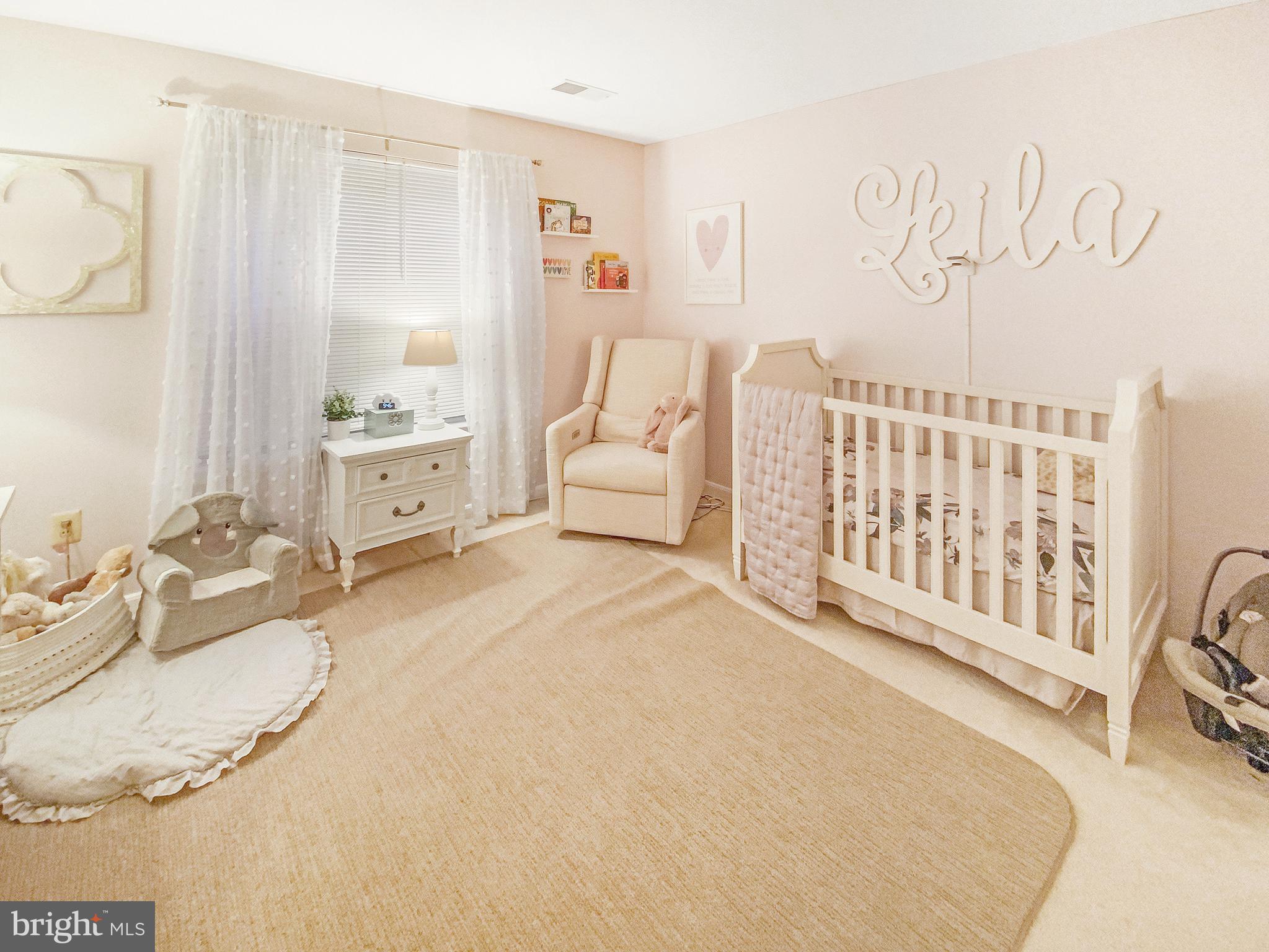 127 Timberbrook Lane, Unit 203 Gaithersburg, MD 20878 - Photo 15 of 29 a spacious bedroom with a bed and a couch
