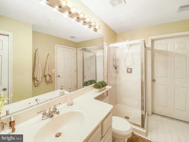 a kitchen with a refrigerator sink stove and cabinets