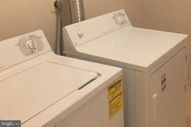 a kitchen with a sink a stove and chairs