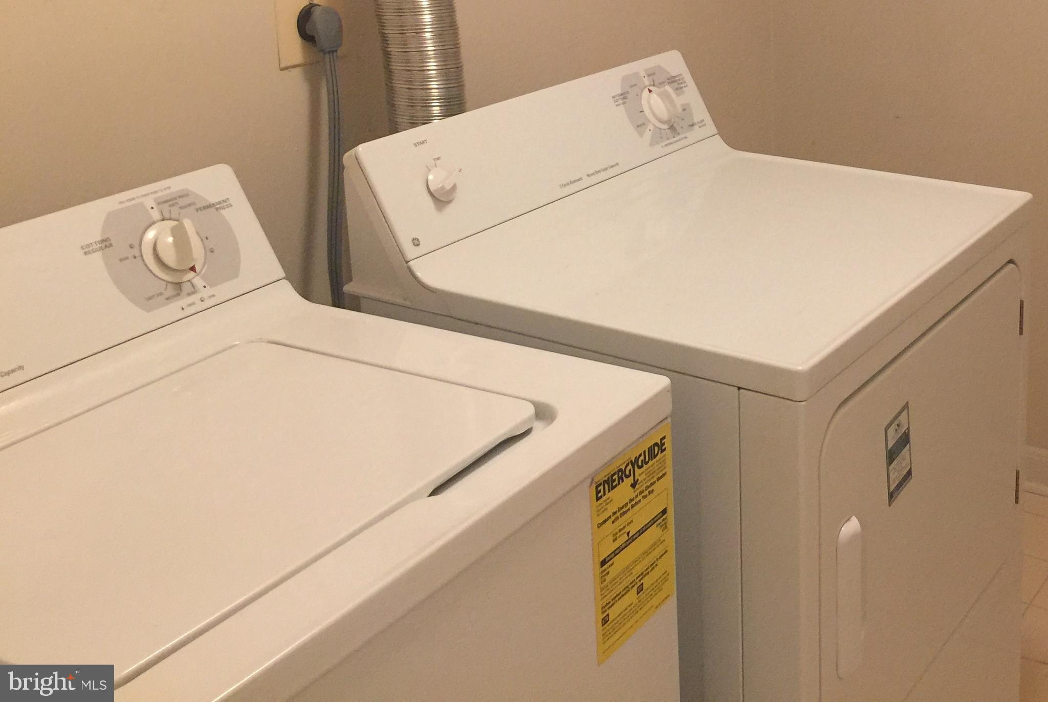 127 Timberbrook Lane, Unit 203 Gaithersburg, MD 20878 - Photo 18 of 29 a utility room with dryer and washer