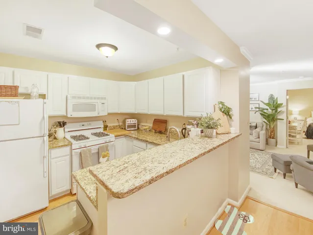a view of a dining room with furniture and window