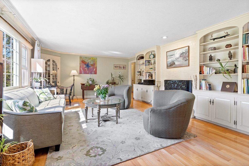 717 George Hill Road Lancaster, MA 01523 - Photo 11 of 36 a living room with furniture and a wooden floor