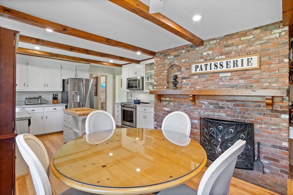 717 George Hill Road Lancaster, MA 01523 - Photo 15 of 36 a view of a kitchen with furniture and chandelier