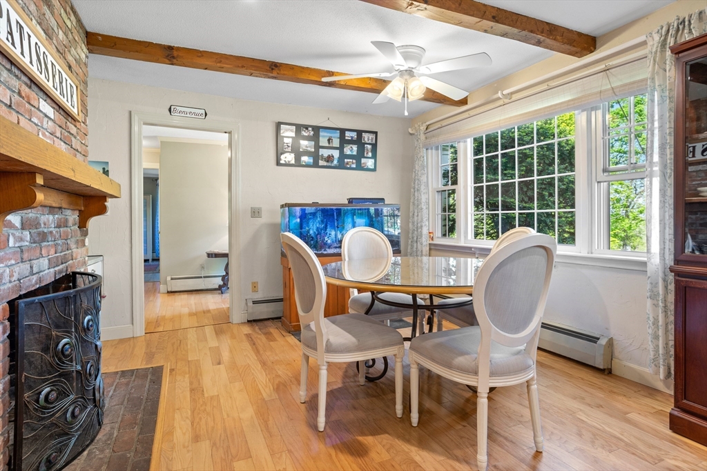 717 George Hill Road Lancaster, MA 01523 - Photo 16 of 36 a view of a dining room with furniture window and wooden floor