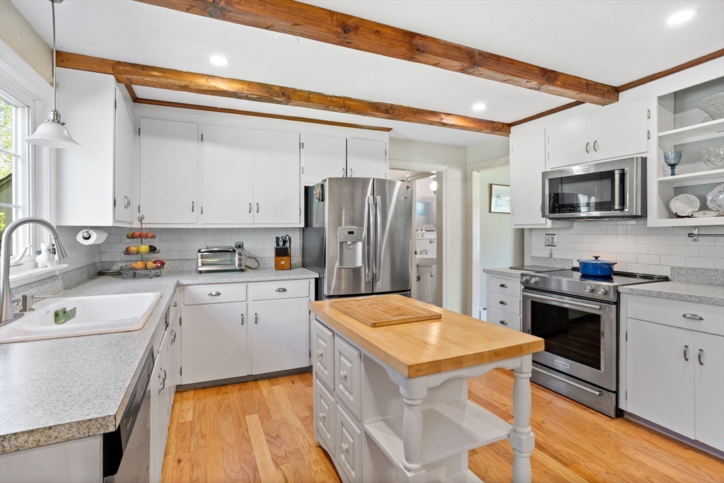 717 George Hill Road Lancaster, MA 01523 - Photo 18 of 36 a kitchen with a sink appliances and cabinets